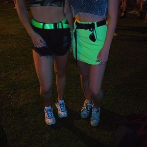 Neon green mini skirt with black belt